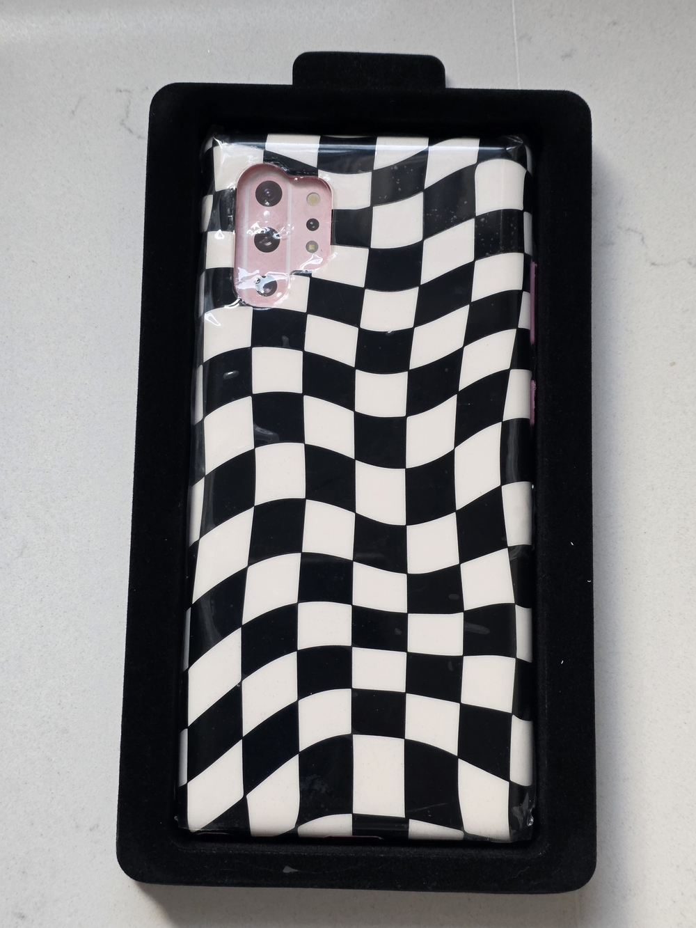 Velvet Caviar Black & White Checkerboard Phone Case with Pink Accents
